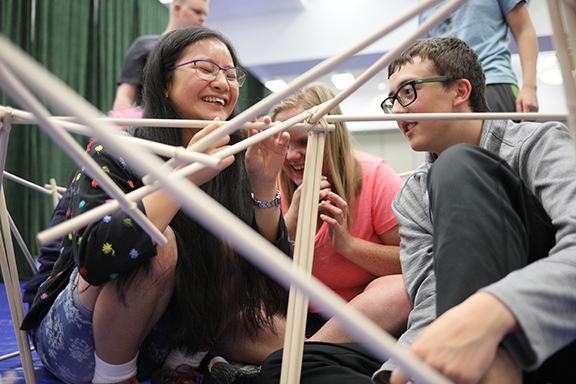 Students at last year&rsquo;s NFB EQ program smile as they work together on a project.